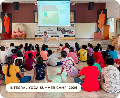 A large group of children seated on the floor during the Integral Yoga Summer Camp, 2026