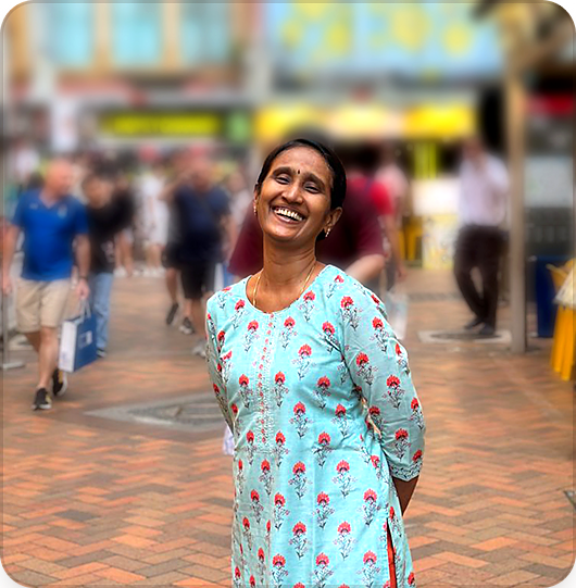 Muthu Annamalai smiling on a city street